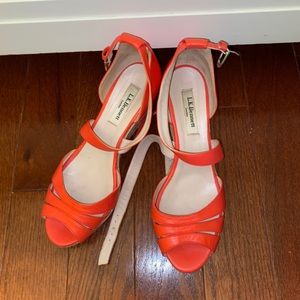 Orangish pink strap wedges